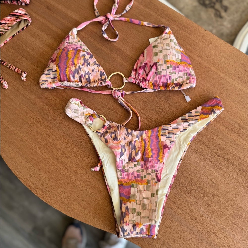 Ibiza multi colored pink bikini with gold embellishments.